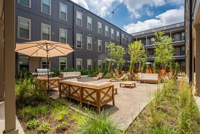 Courtyard Lounge Area with Umbrella and Furniture